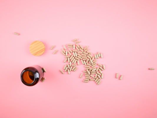 Pile of capsules spilled from a brown bottle