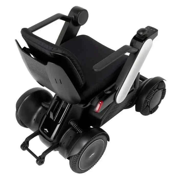 Allied Medical WHILL Model C2 Standard Powerchair Allied Medical WHILL Model C2,maneuverability,Model C2,Omni-wheels,Patented Omni-wheels,powerchair,powerchair accessories,powerchair scooter,Standard Powerchair,superior maneuverability,Travelling with a p