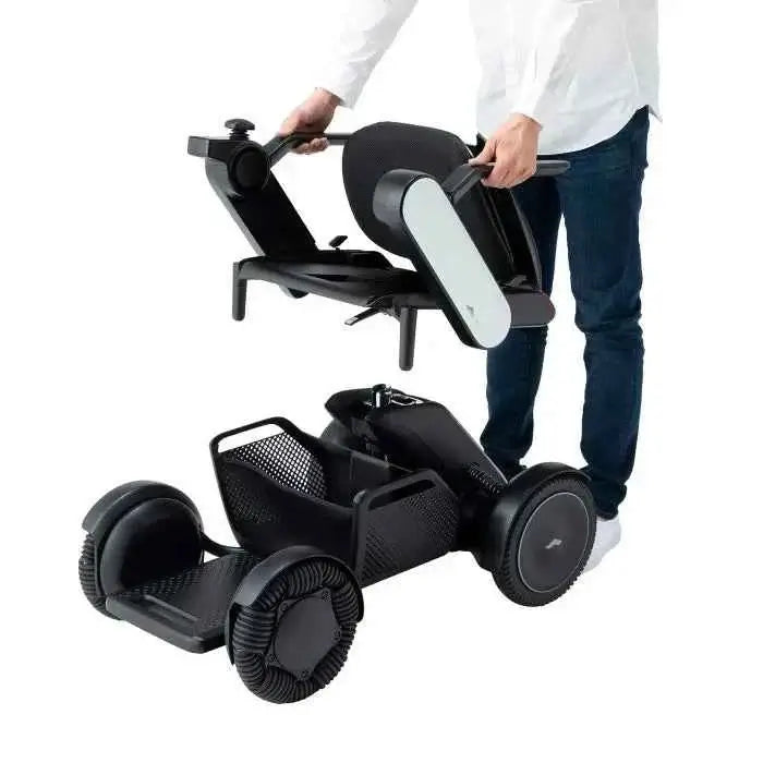 Allied Medical WHILL Model C2 Standard Powerchair Allied Medical WHILL Model C2,maneuverability,Model C2,Omni-wheels,Patented Omni-wheels,powerchair,powerchair accessories,powerchair scooter,Standard Powerchair,superior maneuverability,Travelling with a p